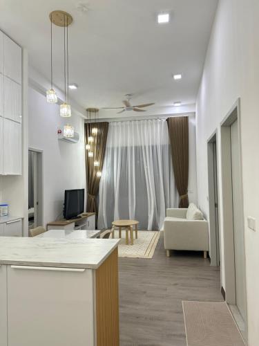 a living room with a couch and a table at Damai Antara Homestay in Putrajaya