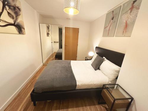 a bedroom with a bed in a room at Media City Salford Quays in Manchester