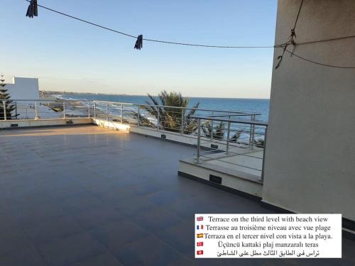 a view of a balcony with the ocean in the background at Gorgeous Villa in Salakta Mahdia in Salakta