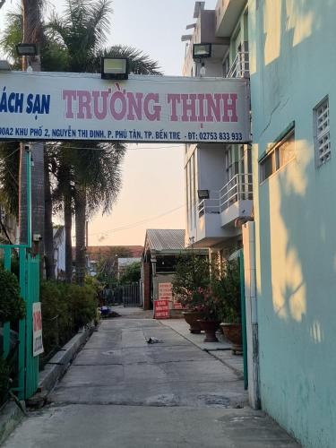 a building with a sign that reads turning time at Khách Sạn Trường Thịnh in Ben Tre