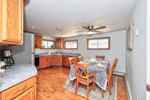 a kitchen and dining room with a table and chairs at Hobbit House, one-of-a-kind home in Bel Air