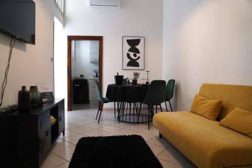 a living room with a couch and a table at RUDIAE Palace In Lecce in Lecce