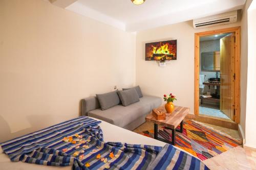Una cama o camas en una habitación de Riad Babette