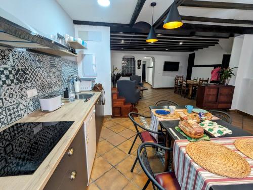 a kitchen with a table with food on it at Alojamiento 13 Jotas in Iniesta