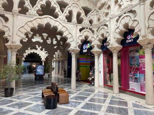 an arcade in a building with columns and ceilings at 2 BHK Townhouse at Pearl in Doha