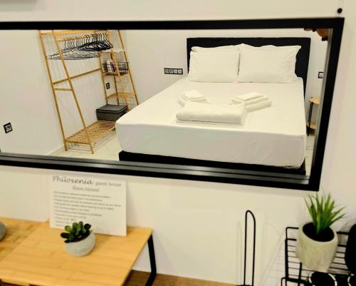 a room with a bed in a mirror at Philoxenia Guest Studio in Himare