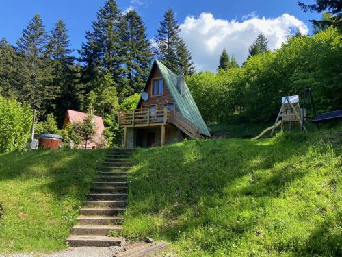 a house on a hill with stairs leading up to it at Chalet Kosorky in Čadca