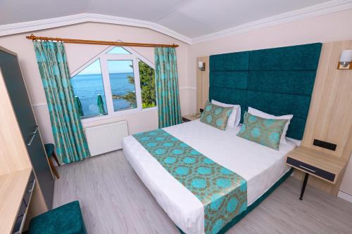 Giường trong phòng chung tại Mare Blu Hotel