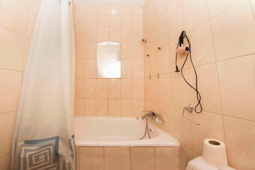 a bathroom with a shower and a tub and a toilet at apartments on Chkalova in Dnipro