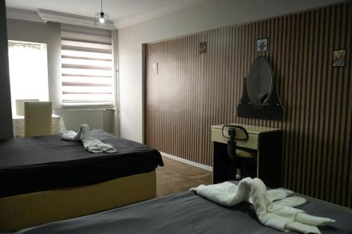 Łóżko lub łóżka w pokoju w obiekcie NIGRUM HOTEL