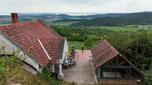 a house with a staircase leading to a house with a view at Borospince Vendégház in Pécsely