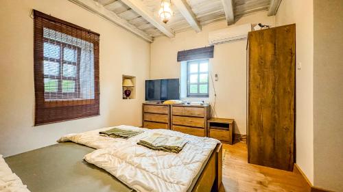 a bedroom with a large bed in a room at Borospince Vendégház in Pécsely