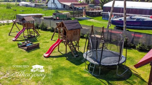 an aerial view of a playground with a play equipment at Domki przy Akacjowej in Rydzewo