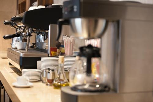 a coffee maker on a counter in a kitchen at Fesa Business Hotel in Gebze
