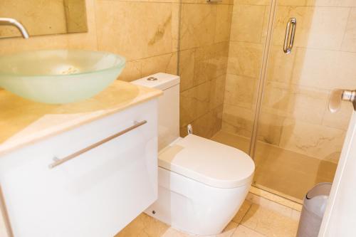 a bathroom with a sink and a toilet and a shower at Oceanview Apt Near Panama City w/ King Bed & More in Playa Bonita Village