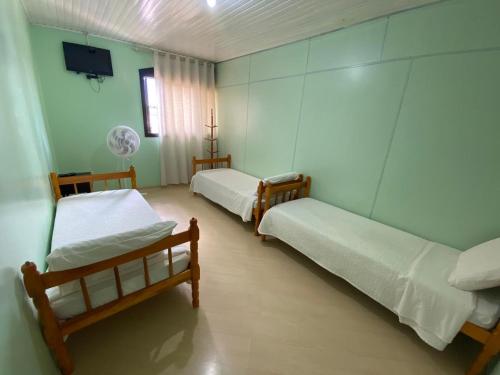 Katil atau katil-katil dalam bilik di Pousada 355