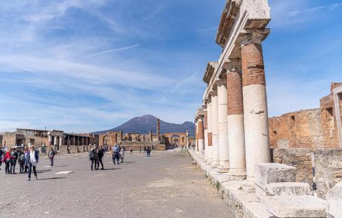 a group of people walking around an ancient building at 3 Bedroom Awesome Home In Filignano in Filignano