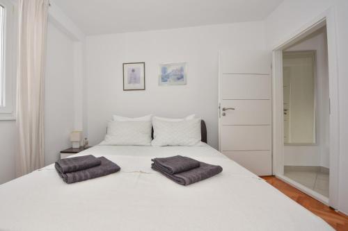 Postel nebo postele na pokoji v ubytování Apartman Lora