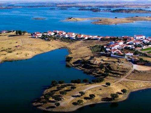 an aerial view of a small island in the water at A Nossa Estrela nº7 in Póvoa de São Miguel