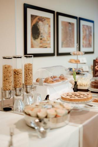 a table with various pastries and other food on it at Tenuta Inagro in San Severo