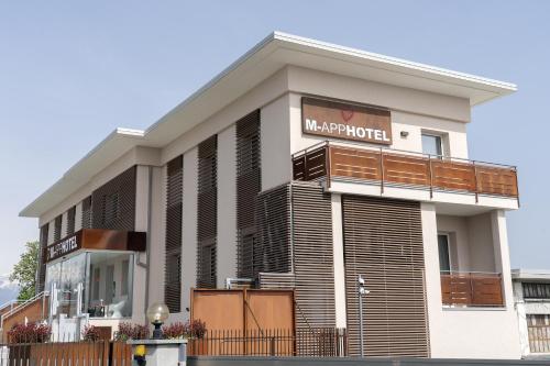 a building with a sign for a hotel at M-APPHOTEL in Benna