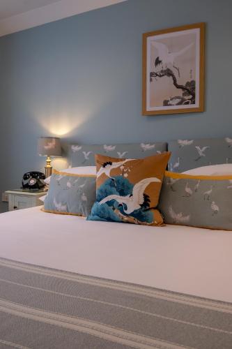 a bedroom with a bed with stars on it at Leeds Castle Stable Courtyard Bed and Breakfast in Maidstone