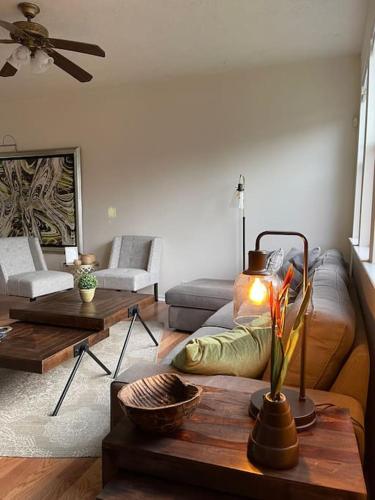 a living room with a couch and a table at Amazing house in Woodlands fully equipped for 6 in Conroe