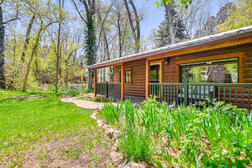 a log cabin in the woods with a yard at Creekside Cabin Retreat with Private Deck in Payson in Payson
