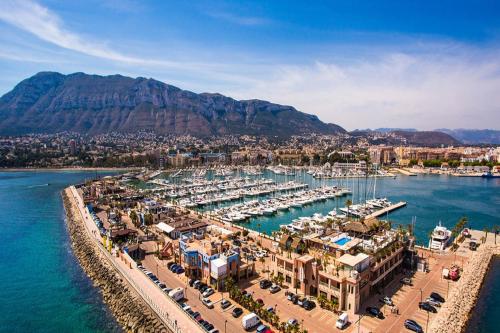 an aerial view of a harbor with boats in the water at Experiencia Premium en la Esencia de Denia in Denia