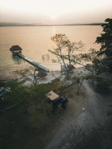 a dock in the middle of a body of water at Mini Camper Honda Element in Guatemala