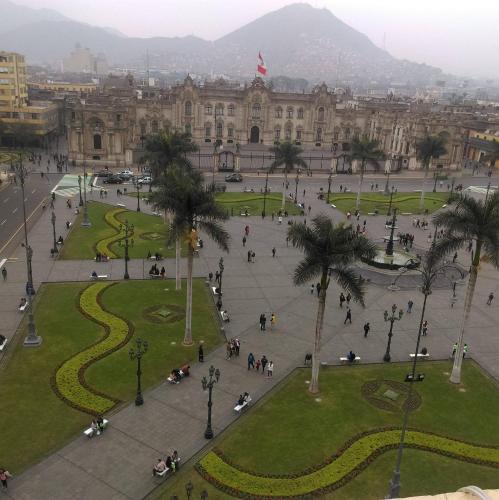 an aerial view of a park in front of a building at Hostal President in Lima