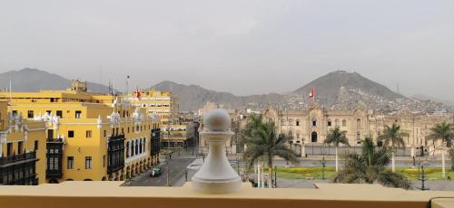 a view of a city from a balcony at Hostal President in Lima