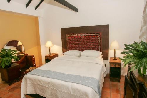 Cama o camas de una habitación en Hacienda Flamingo