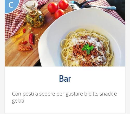 a plate of pasta in a bowl on a table at ERMAN HOUSE Perla nera veneziana in Dolo