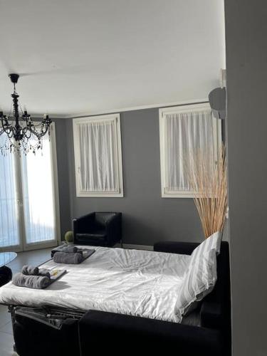 a bedroom with a bed with two pillows on it at ERMAN HOUSE Perla nera veneziana in Dolo