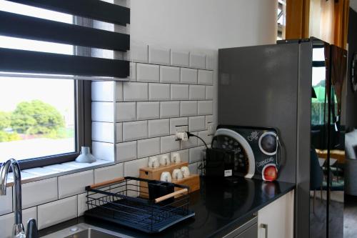 a kitchen with a black counter and a window at Lux Penthouse Apartment 3 bedrooms Quatre Bornes in Quatre Bornes