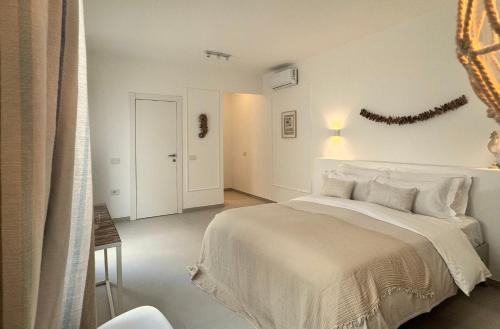 En eller flere senge i et værelse på La Casa Al Mare