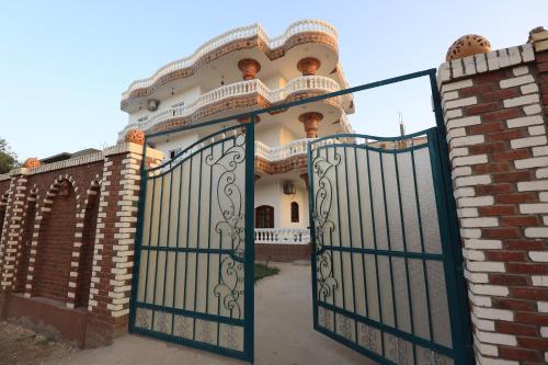 an entrance to a house with an iron gate at Ramsses Palace in Luxor