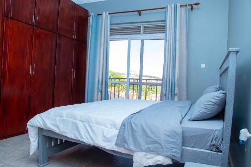 Postel nebo postele na pokoji v ubytování Aster Homes