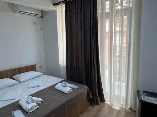 Łóżko lub łóżka w pokoju w obiekcie Dalida Hotel