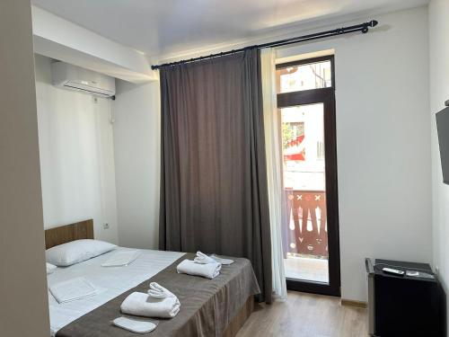 Cama o camas de una habitación en Dalida Hotel