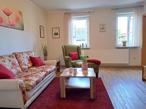 a living room with a couch and two chairs at Haus Lieberum Ferienwohnung 1.Etage Balkon in Bad Sooden-Allendorf