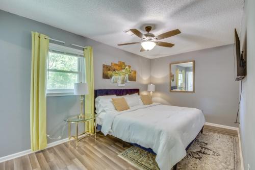 A bed or beds in a room at Athens Home with Deck - Near Sanford Stadium!
