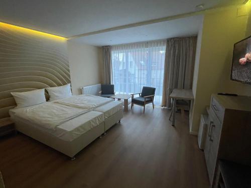 Postel nebo postele na pokoji v ubytování Hotel Andrea