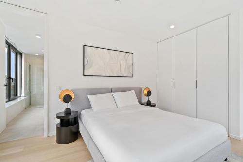 Stylish Downtown Escape with Comfortsにあるベッド