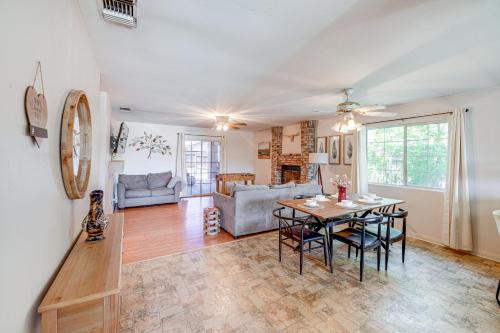 a dining room and living room with a table and chairs at Fun-Filled Backyard Bakersfield Family Haven! in Bakersfield