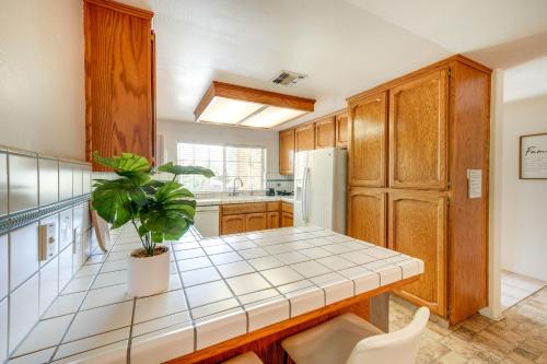 a kitchen with a potted plant sitting on a counter at Fun-Filled Backyard Bakersfield Family Haven! in Bakersfield
