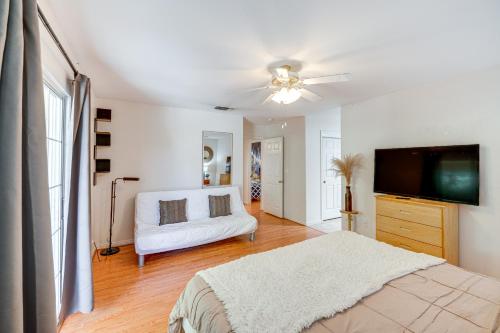 a bedroom with a bed and a flat screen tv at Fun-Filled Backyard Bakersfield Family Haven! in Bakersfield