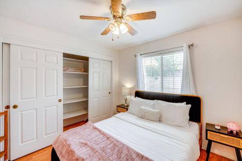 a bedroom with a bed and a ceiling fan at Fun-Filled Backyard Bakersfield Family Haven! in Bakersfield