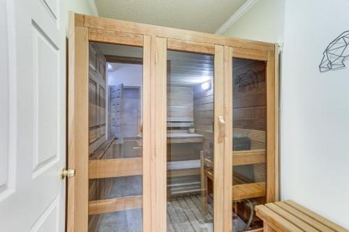 a walk in closet with a wooden door at Spacious Massanutten Home with Hot Tub and Sauna! in McGaheysville